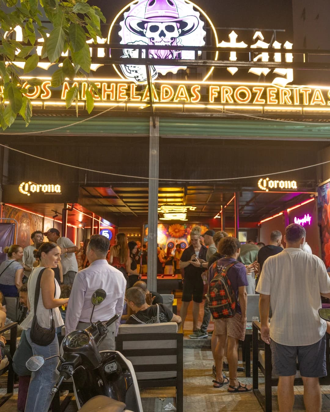 The neon storefront after dark